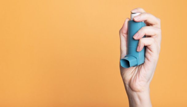 Hand,Holds,Inhaler,To,Treat,Asthma.,World,Asthma,Day.,Concept