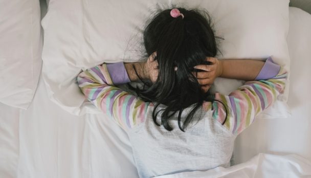 Girl,Covering,Ears,With,His,Fingers,In,Bed,,Adhd,,Sleep