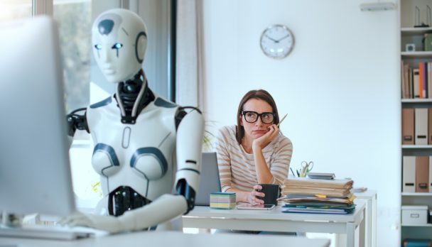 Disappointed,Stressed,Woman,And,Ai,Robot,Sitting,At,The,Office