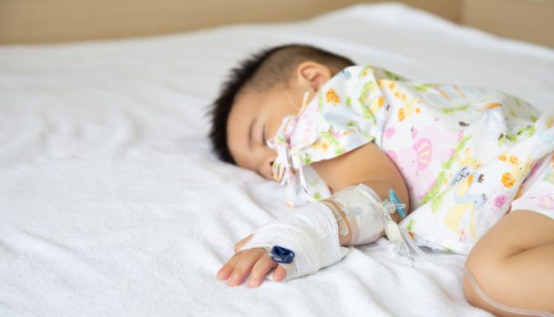 Asian,Baby,Boy,Sleeping,On,Bed,With,Infusion,Set,At